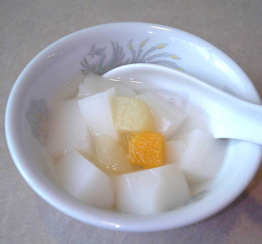 Xingren Donfu look like wet marshmellows, served with fruits and is one of the foods that start with X