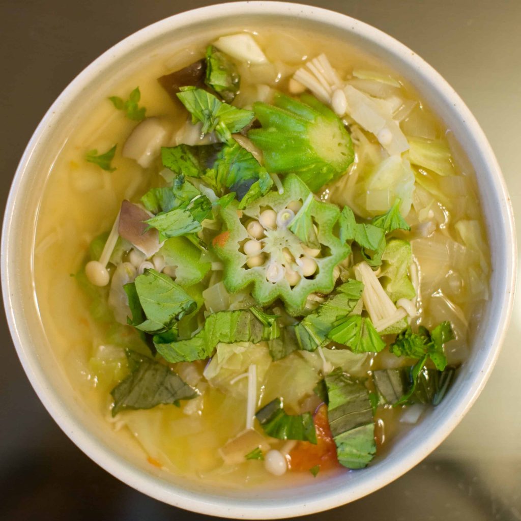 Xidoufen is a soup that is served with  lettuce, spring onions coriander sprinkled on it