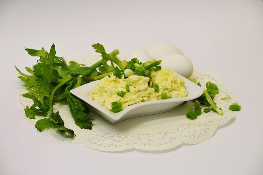 Egg salad with spring onions and coriander topping