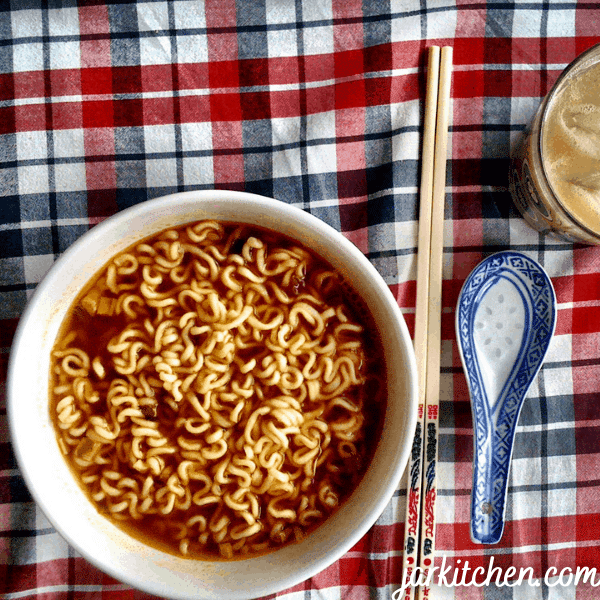 Being one of the foods that start with I, Instant Ramen in this photo is served in a bowl with chopsticks alongside it